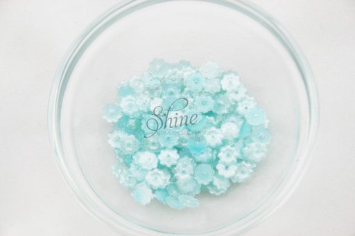 Plastic Flower Margarite Sew On Stones Pale Blue Glitter